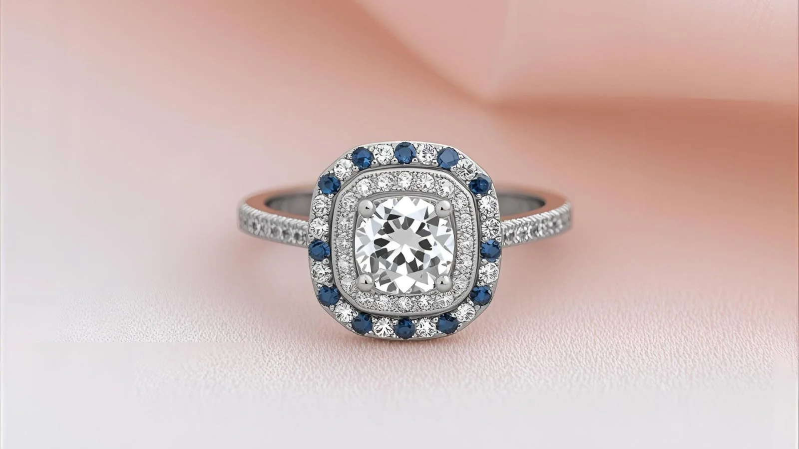 “Vera Wang Wish double-halo diamond engagement ring with blue sapphire accents in 14K white gold.”